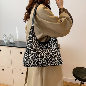 Large leopard print tote bag with black leather straps for women's daily commute fashion