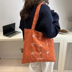 Orange corduroy tote bag with white embroidery embroidery for daily commuting