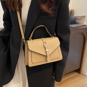 Fashionable khaki leather crossbody bag with belt buckle detail and top handle