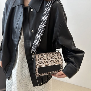 Fashion leopard print crossbody bag with wide geometric strap and black leather base