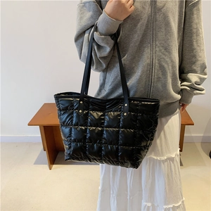 Chic black quilted puffer tote bag for women featuring stylish large square stitching