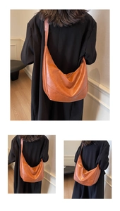 Detailed view of caramel leather hobo bag showing its large capacity and soft texture