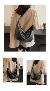 Detailed views of a black large-capacity minimalist hobo bag styled with a chic beige blazer