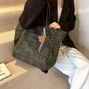 Large leopard print canvas tote bag with a cute bear plush pendant for women