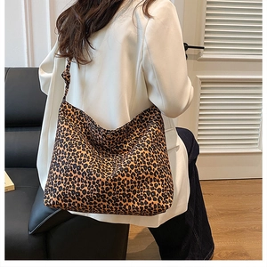 Leopard print tote bag detail showing large capacity and knotted shoulder strap style