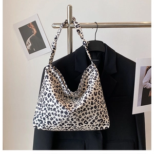 Fashionable leopard print large canvas hobo bag featuring stylish shoulder knot design
