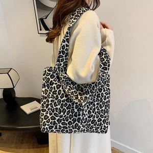 Stylish black and white leopard print canvas tote bag with wide shoulder strap
