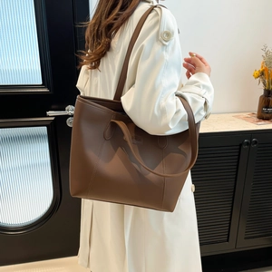 Large dark brown leather tote bag for women with double straps and fashion patch