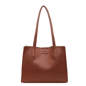 Minimalist brown matte leather tote bag with vertical stitching and long shoulder straps