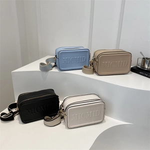 Minimalist square crossbody bags with letter print in blue, beige, black, and white colors