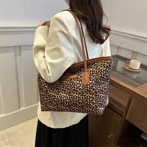 Chic leopard print canvas tote bag with brown leather handles for daily casual use