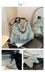 Detailed view of green geometric jacquard canvas tote with wide black shoulder strap