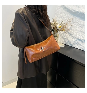 Brown vintage faux leather shoulder bag featuring a silver star metal ornament on side