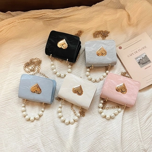 Chic quilted crossbody bag with pearl handle and heart lock in five elegant colors