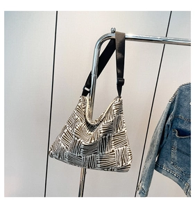 Macro shot of durable canvas texture and black and white geometric pattern on tote bag