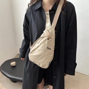 Minimalist beige nylon crossbody chest bag with water-resistant fabric and large capacity