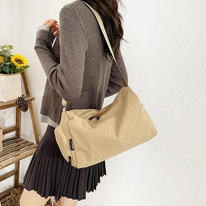 Minimalist khaki nylon shoulder bag for women with casual crossbody strap design