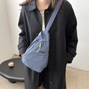 Minimalist blue nylon crossbody chest bag with adjustable wide shoulder strap for daily use