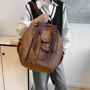 Large coffee nylon travel backpack with dual handles and adjustable shoulder strap