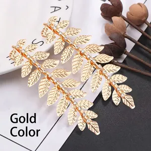Elegant gold leaf hair clips with rhinestones for bridal hairstyles in Roman style