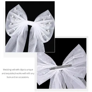 Elegant white mesh bow hair clip with pearl accents for bridal wedding hair styling