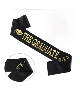 Detail of THE GRADUATE satin sash with gold foil lettering and doctoral cap icon