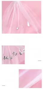Detailed close-up of pink mesh bridal veil with golden Bride to be lettering