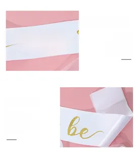 Detail of white satin bridal sash with elegant gold foil Bride to be lettering