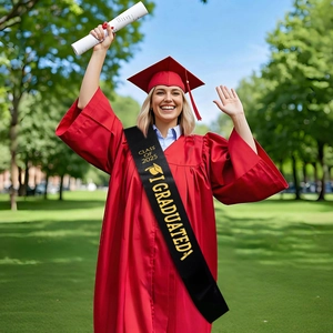 Class of 2026 graduation sash set with red gown and mortarboard in outdoor setting