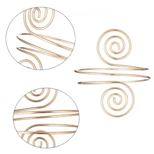 Detailed macro view of the gold spiral armlet showcasing polished plating and sleek curves