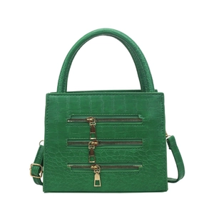 Green faux crocodile leather handbag with decorative metal zippers and shoulder strap