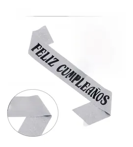 Detail of silver glitter Feliz Cumpleaños sash with high-quality black stamped lettering