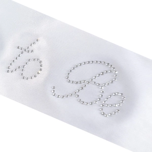White satin sash with sparkling silver rhinestones spelling 40 & Fabulous for birthday party