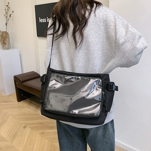 Minimalist black canvas crossbody bag with transparent PVC pocket and adjustable strap