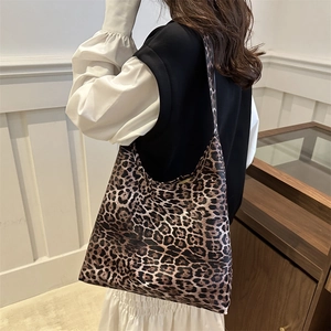 Large capacity leopard print tote bag for women shown from a 45-degree side view