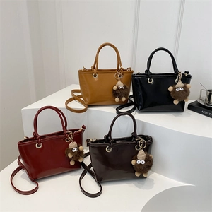 Chic 2024 retro bucket bags in four colors with fluffy eye pendants and long shoulder straps