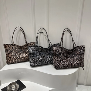 Three leopard print tote bags in brown, grey, and red patterns for stylish autumn commuting