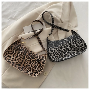 Classic brown and grey leopard print hobo bags on beige blazer with golden zipper