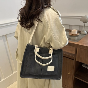 Retro black canvas tote bag with multi-pockets and contrast white handles for women