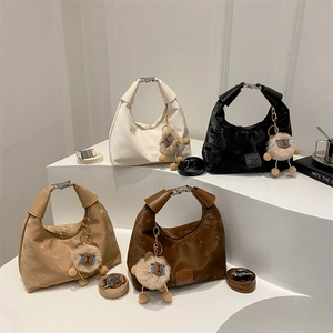 Pleated dumpling shoulder bag in four colors with adjustable strap and sheep pendant