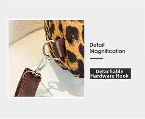 Detailed view of the detachable silver metal hook and leopard print faux suede fabric