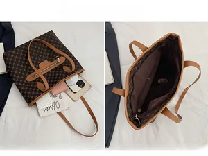 Detail view of large brown vintage tote bag interior and size comparison with daily items