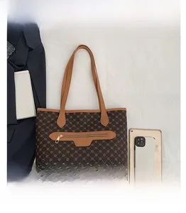 Detail view of large retro tote bag with dark diamond pattern and front zipper pocket