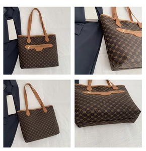 Detail view of vintage printed tote bag with metal zipper and leather texture