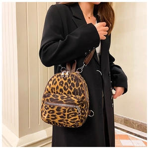Close-up of stylish leopard print suede backpack with high-quality metal zippers