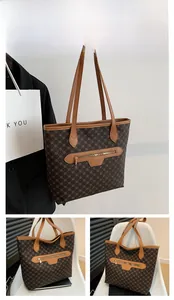 Detailed views of brown vintage floral tote bag with zipper and dual shoulder straps