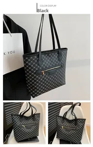 Detail of black tote bag with gray geometric chain print and gold metal zipper pocket