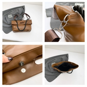 Detail view of brown PU leather tote bag with magnetic closure and silver hardware accents