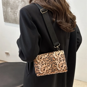 Chic leopard print crossbody bag with wide black shoulder strap for women winter fashion