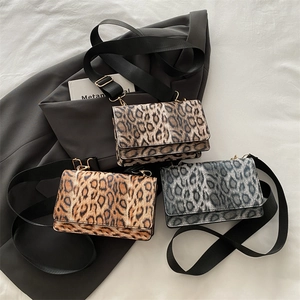 Three leopard print crossbody bags with wide straps in brown grey and dark coffee colors